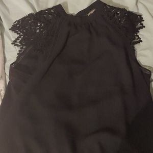 Black, lace, sleeveless blouse.